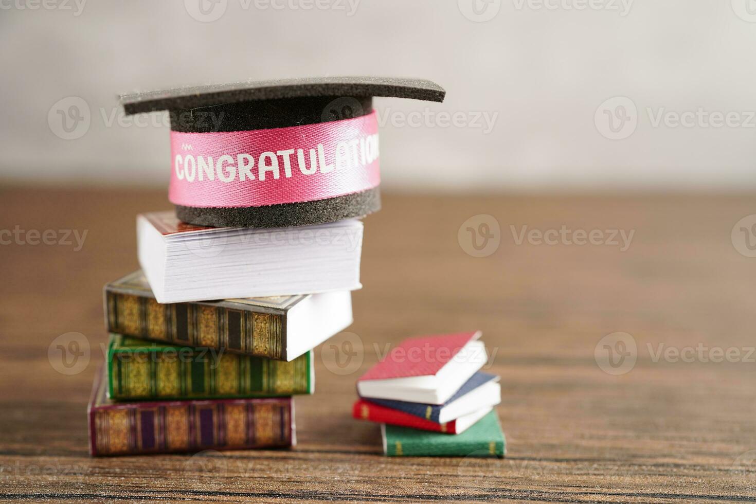 Graduation hat on book with copy space, learning university education concept. photo