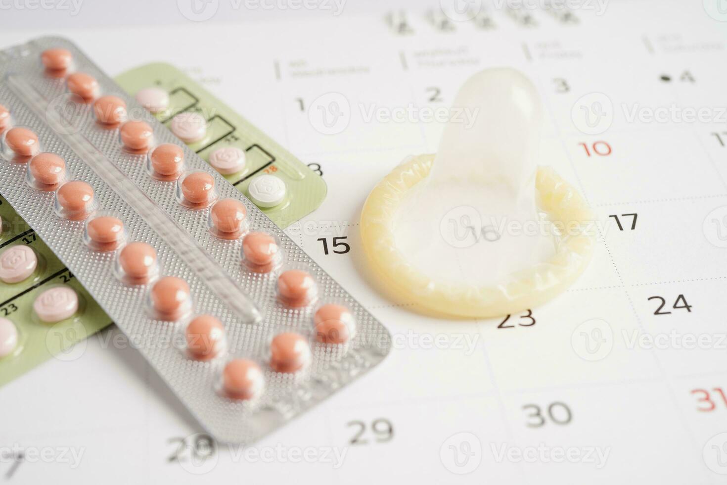 Condom and birth control pills for prevent infection, safe sex  and birth control. photo