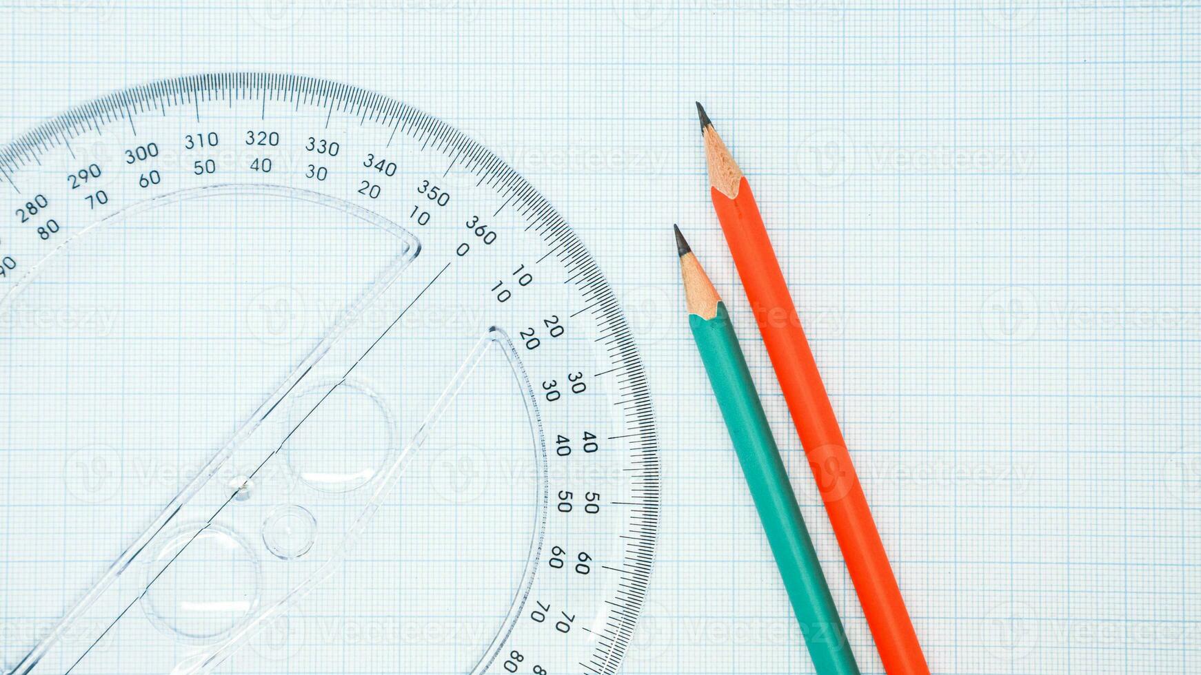 High Angle View Of Pencil With Graph Paper And Ruler photo