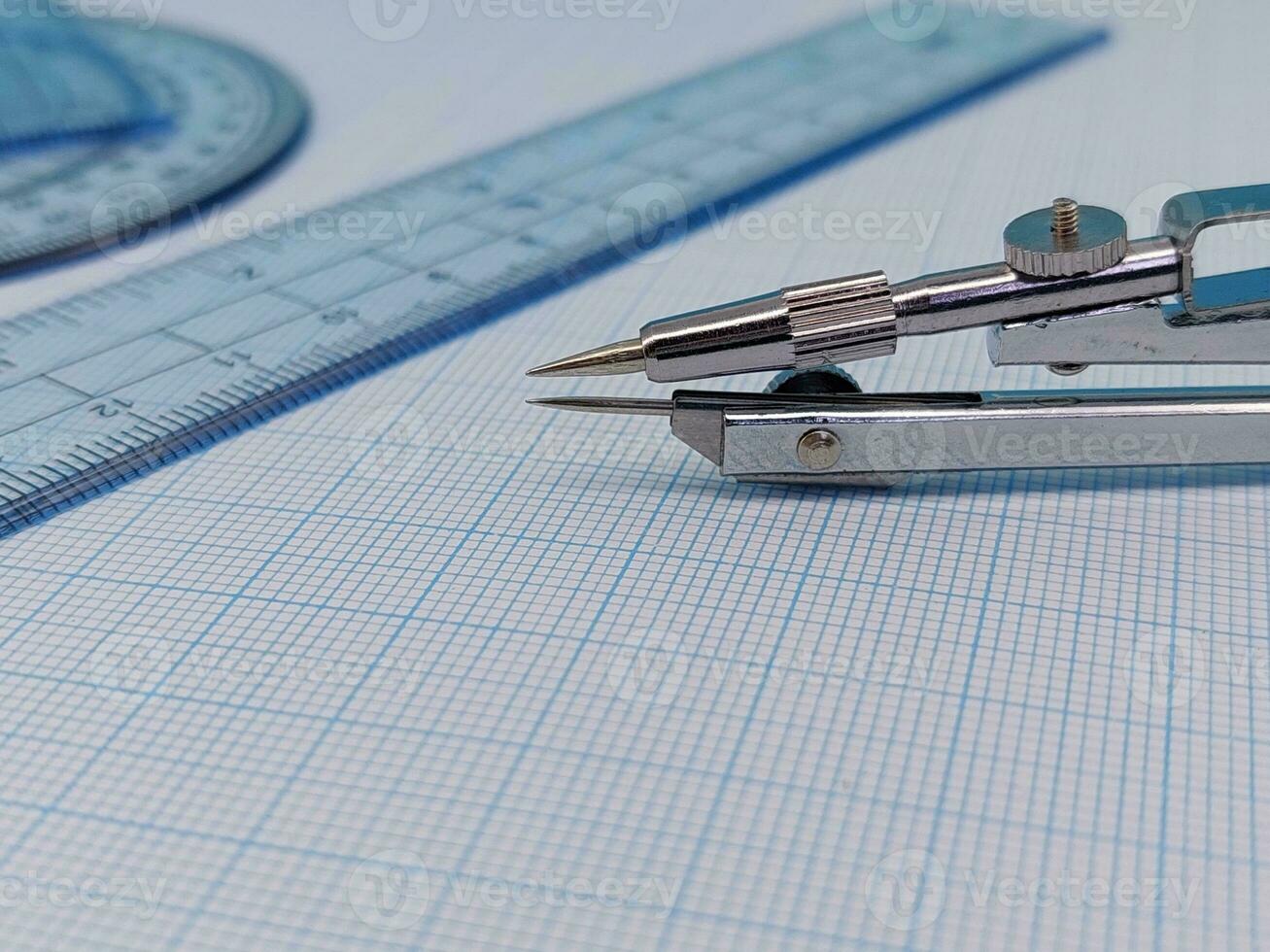 Compass and protractor for math and engineers or architect photo