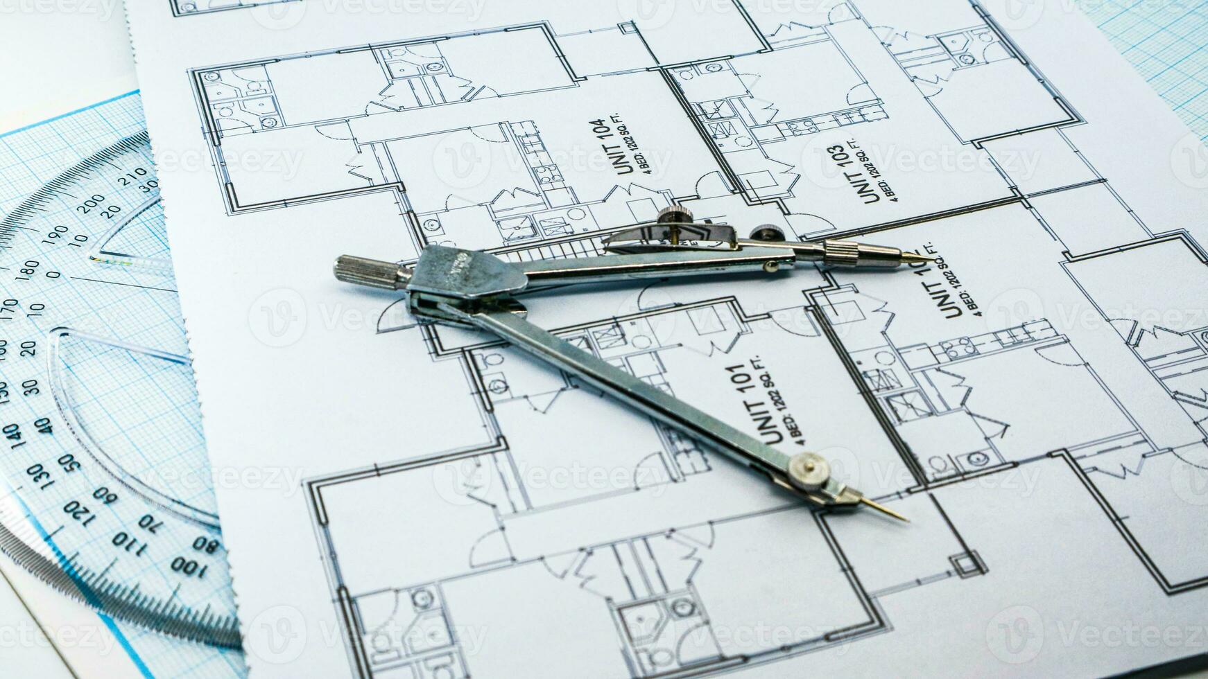 Office blue print with drawing compass and ruler photo