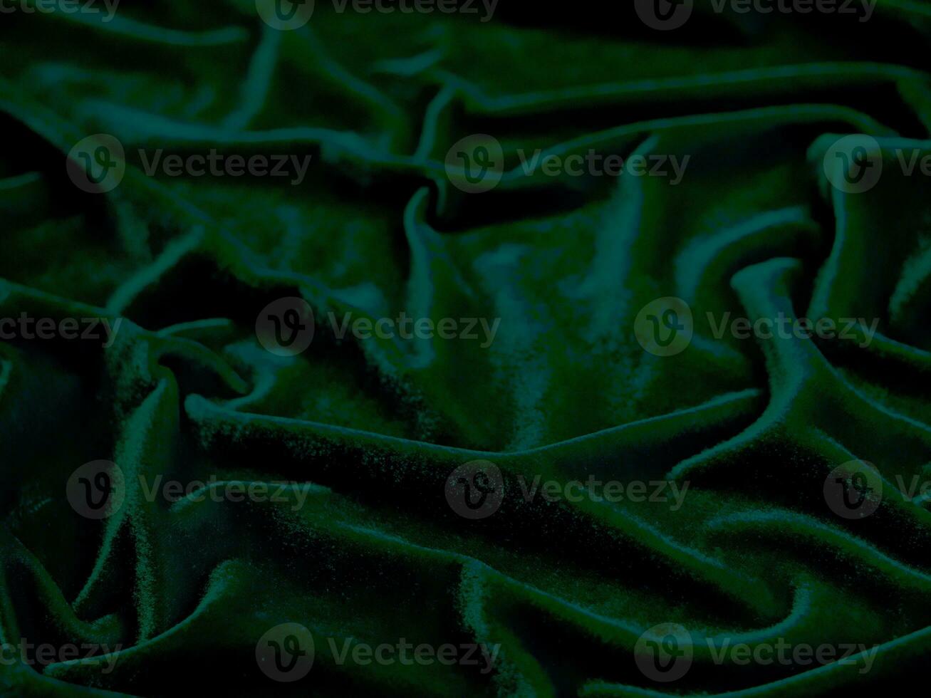 Green velvet fabric texture used as background. Empty green fabric background of soft and smooth textile material. There is space for text. photo