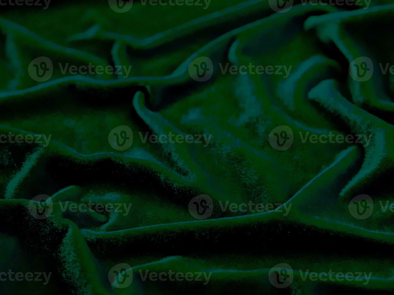 Green velvet fabric texture used as background. Empty green fabric background of soft and smooth textile material. There is space for text. photo