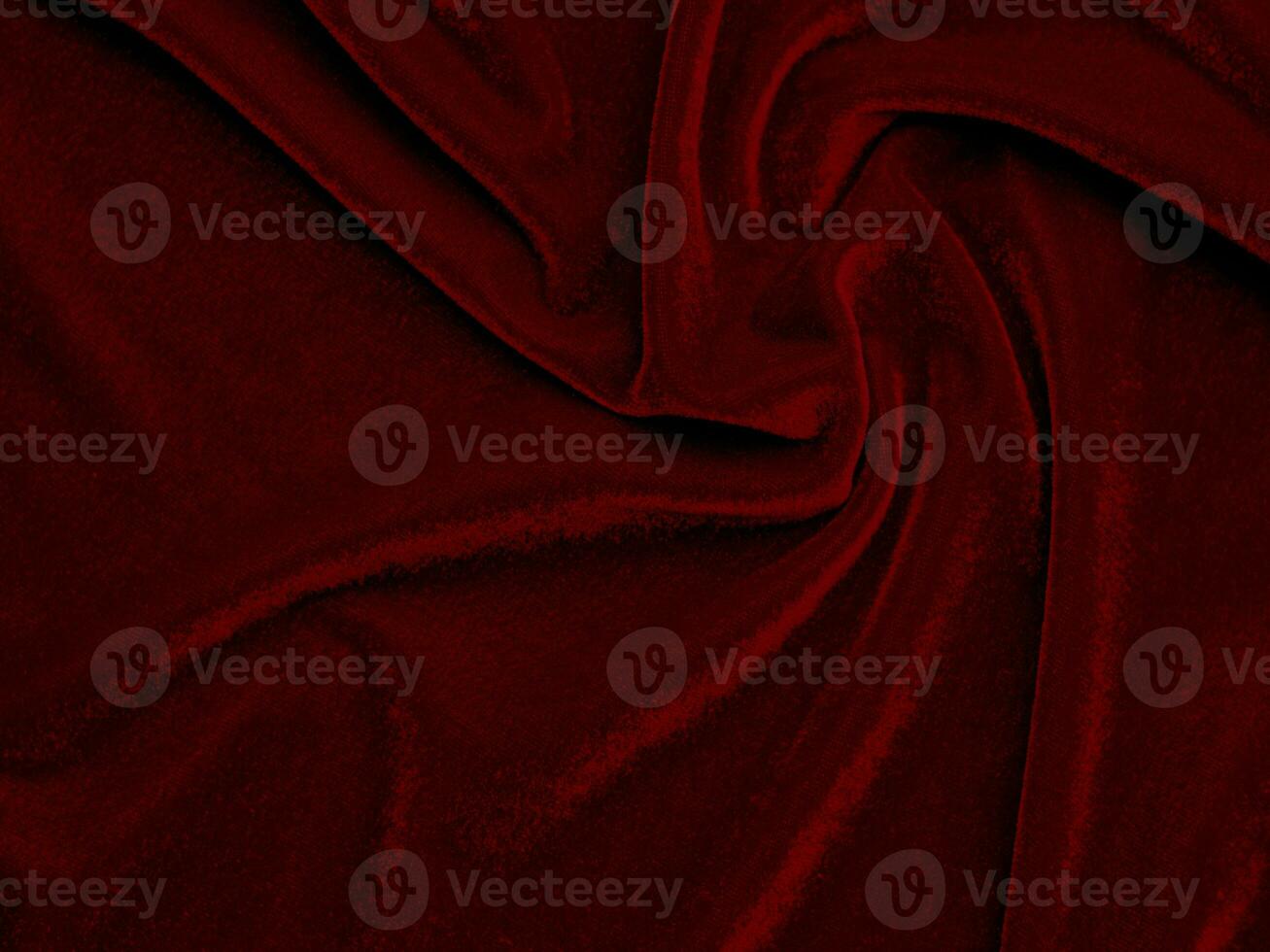 textura de tela de terciopelo rojo utilizada como fondo. fondo de tela roja vacía de material textil suave y liso. hay espacio para el texto.. foto