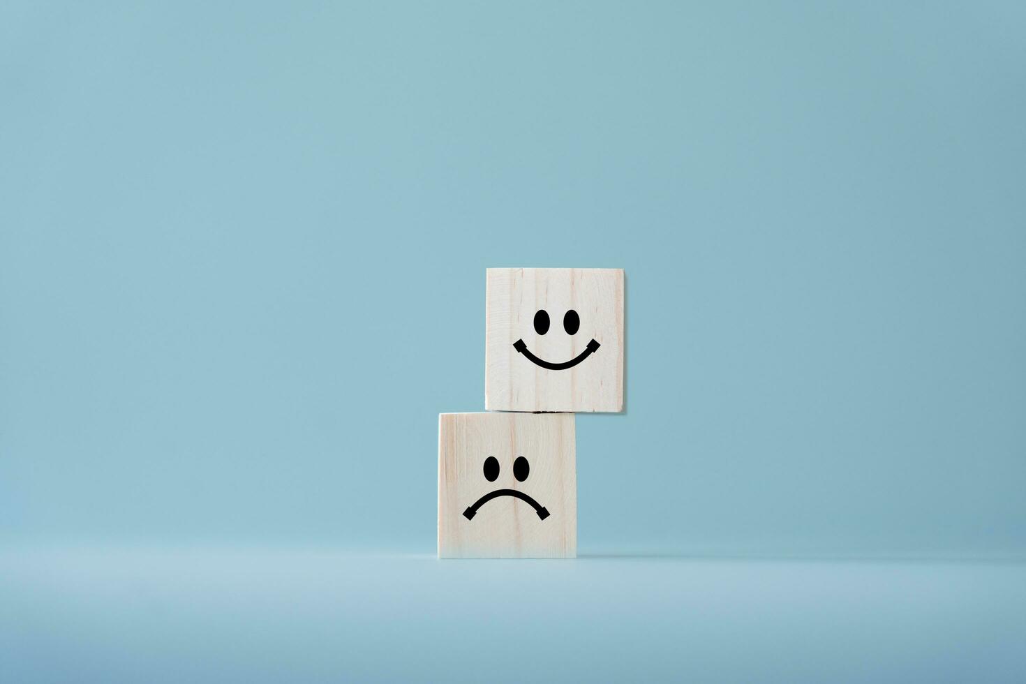 Concept of customer satisfaction review. Wooden blocks with facial expression. To evaluate business performance you need a survey from customer experience. photo