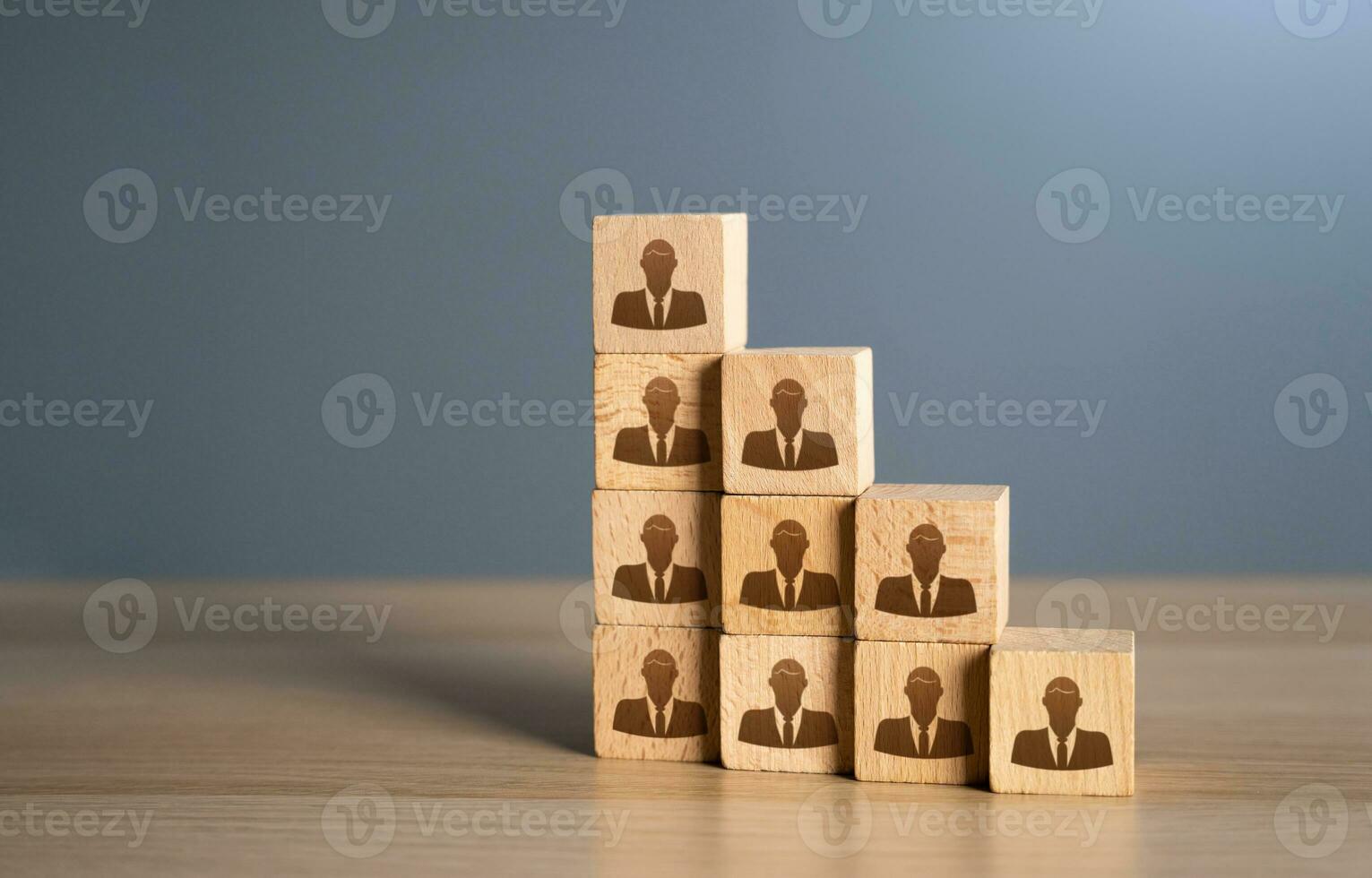 A growing blocks ladder of company employees. Putting people in their places. Opening of new jobs. Assemble a team of employees. How many workers can you effectively manage. photo
