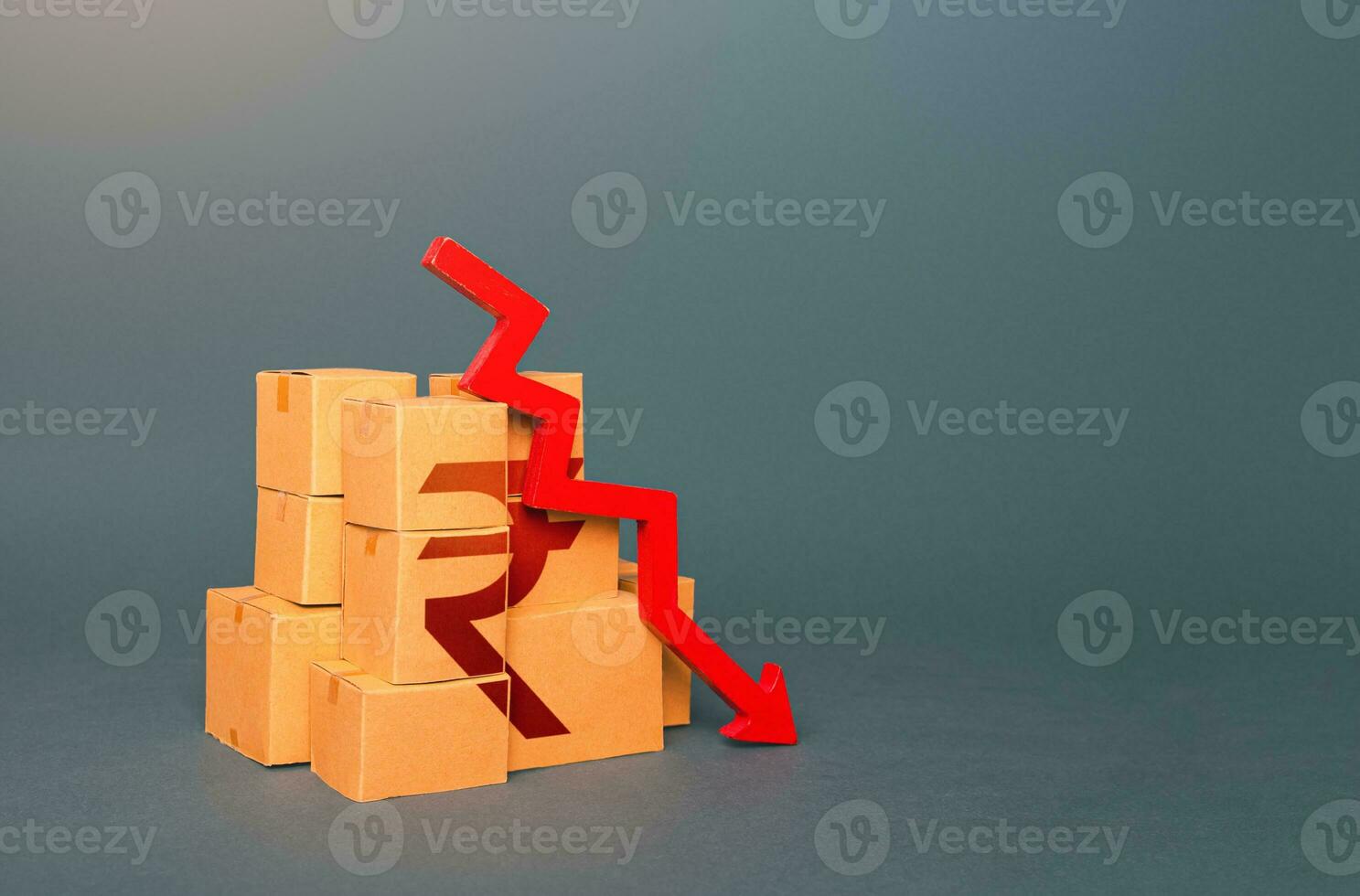 Boxes with indian rupee symbol and down arrow. Decrease in stocks of products. The fall in the production of goods. Sanctions. Low consumption. Economic slowdown. Price reduction. Worsening trade. photo