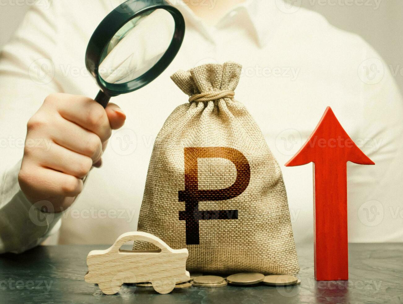 A woman inspects a russian ruble money bag and a car. Growing sales. Electric vehicle support subsidies. Expensive car maintenance. High price of insurance. Rise of fuel excise taxes. photo