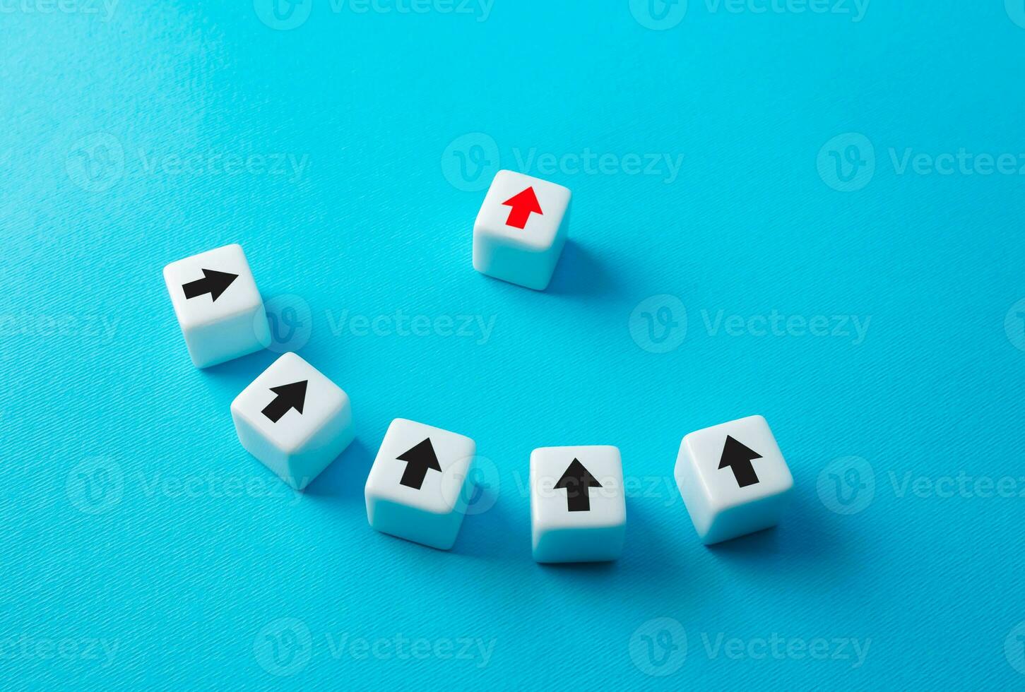 The red arrow takes the lead and guides the team in the right direction. Quality leadership, administration skills and project management. Corporate. Cooperation teamwork. Leader leads his team. photo