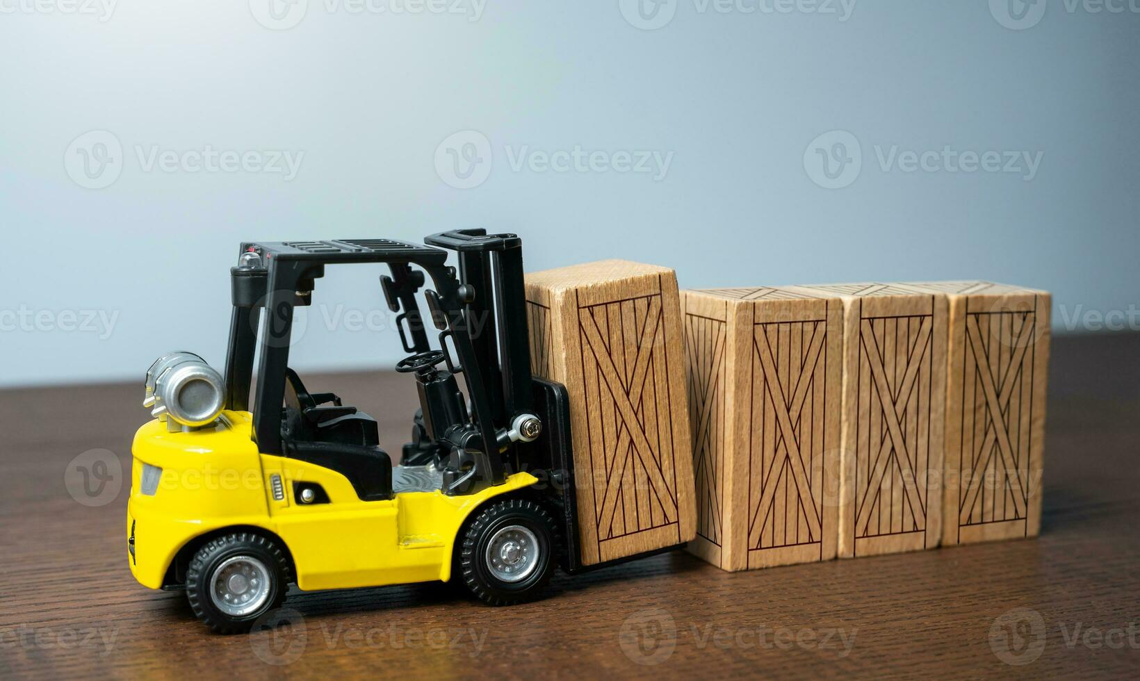 Forklift stacks wooden crates. Transportation industry. Transport department. Warehousing and logistics concept. photo