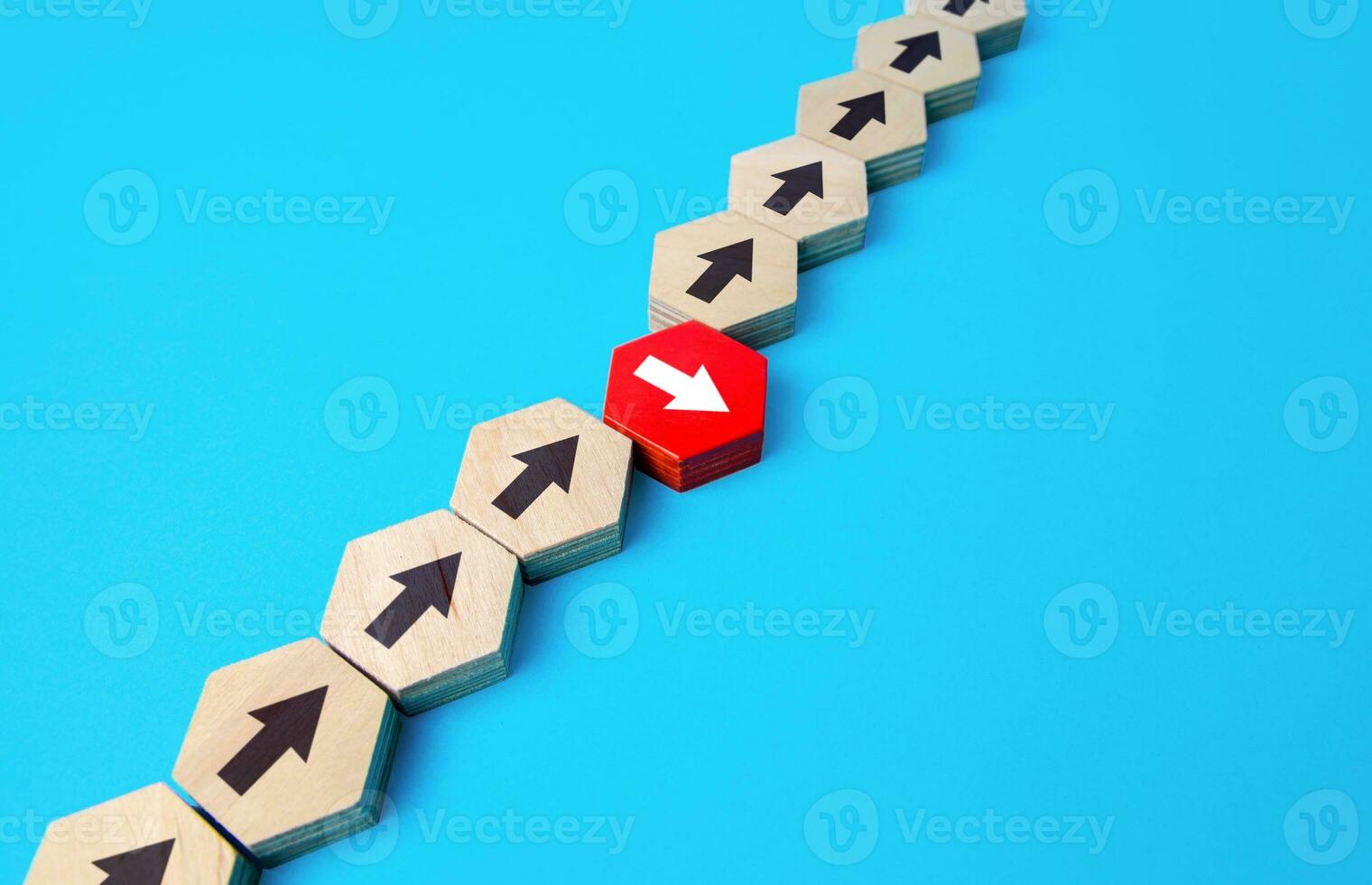 An arrow breaks formation. Process chain breaking. Thinking outside the box. New strategies and solutions. Atypical thinking leadership qualities. Denial of conformism. Detachment and uniqueness photo