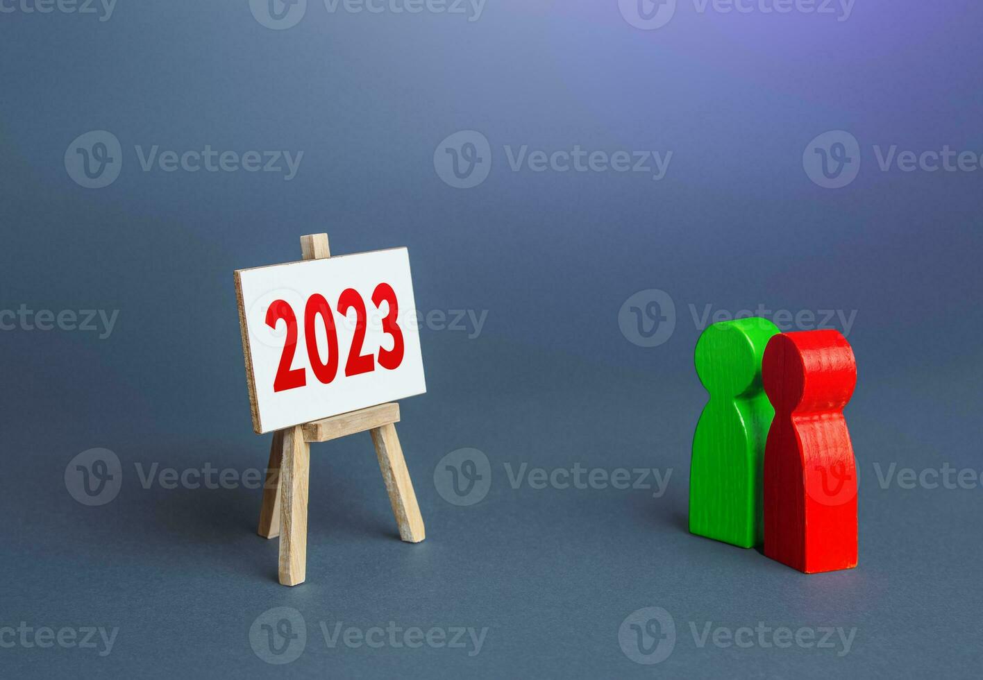 People look at 2023 year easel. Summing up, analytics and forecasting. Report presentation. Summarizing. Analysis of companys economic performance. Statistics. Set new plans and goals for next year. photo