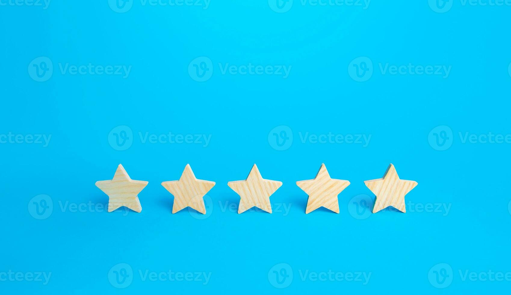 Five stars on a blue background. Rating evaluation concept. High satisfaction. Good reputation. Popularity rating of restaurants, hotels or mobile applications. Highest score. Service quality feedback photo