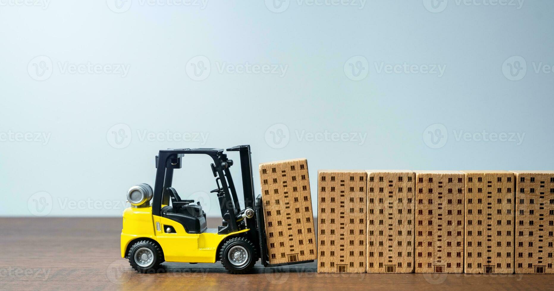 Forklift builds apartment residential buildings. Construction industry. Providing housing infrastructure for growing communities. Progress and development. New housing options become available photo