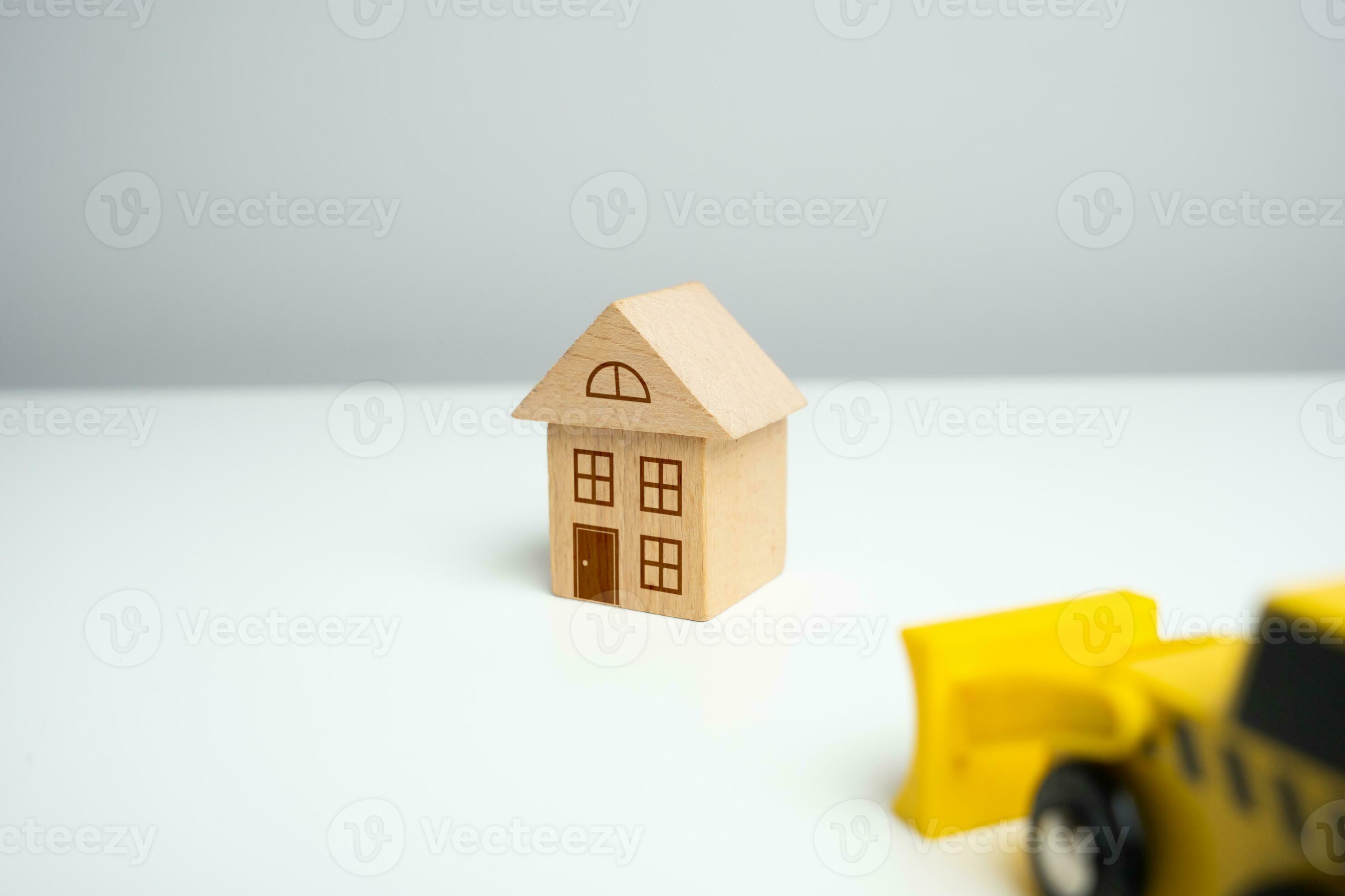 The bulldozer is about to demolish the house. Encroachment on private