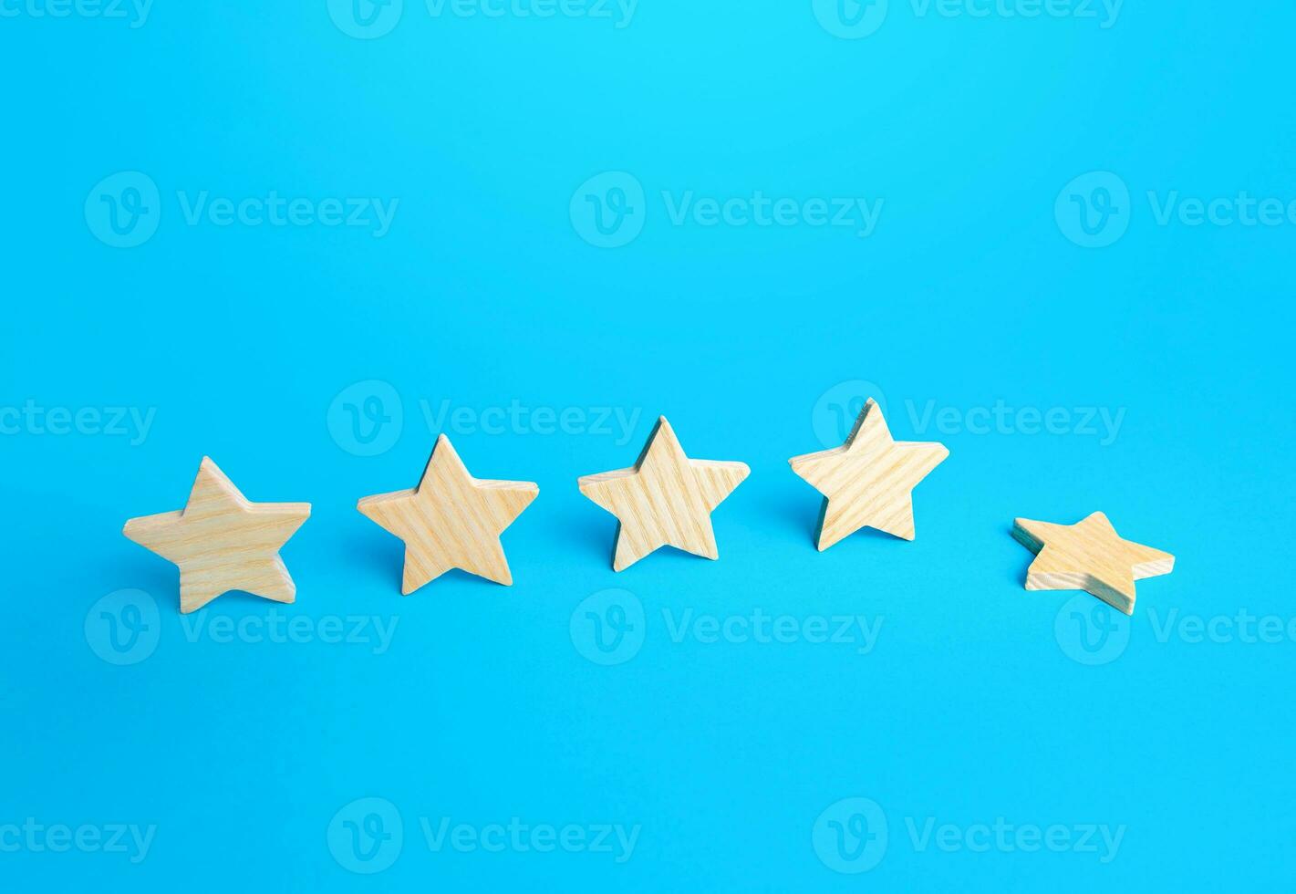 One of the five stars fell down. Loss of the fifth star. Drop in rating, prestige and reputation reduction. Lowering and demotion. Do not meet the requirements. Decline in quality and level of service photo