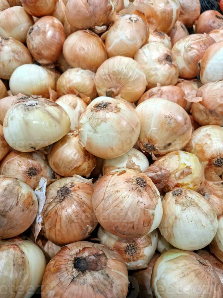 Fresh raw onions as background, food photo