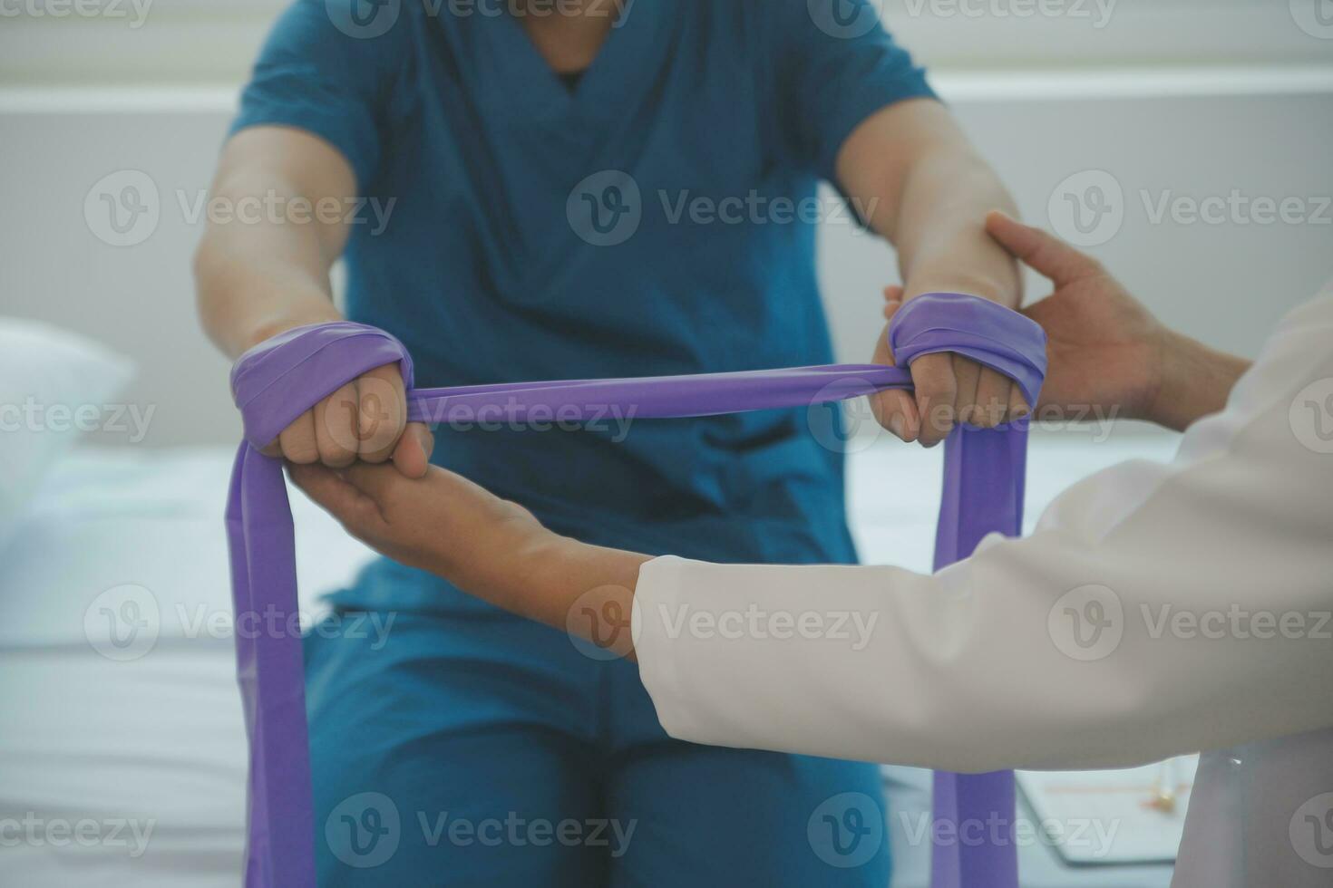 Physiotherapist working with patient in clinic, closeup photo