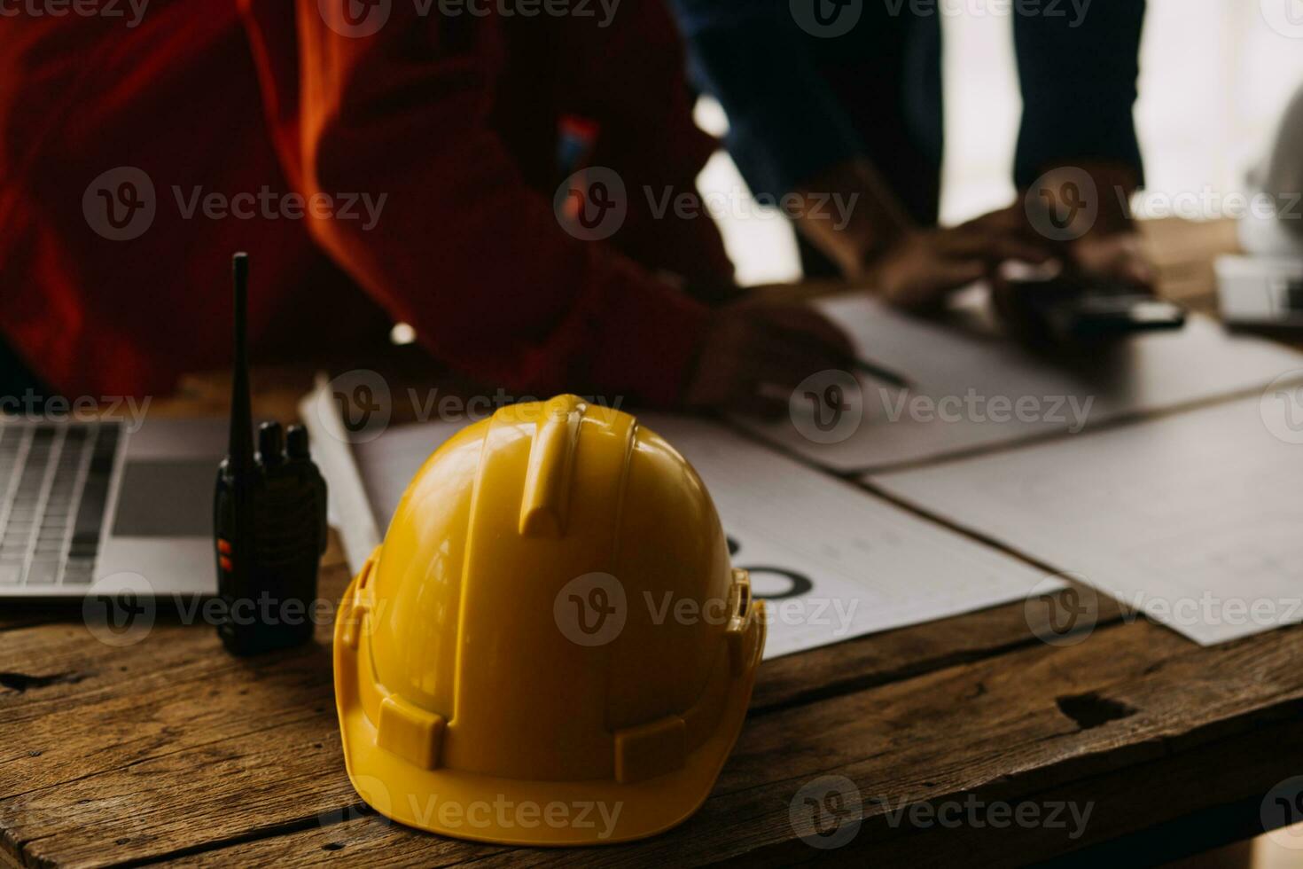 Construction concept of Engineer and Architect working at Construction Site with blue print photo