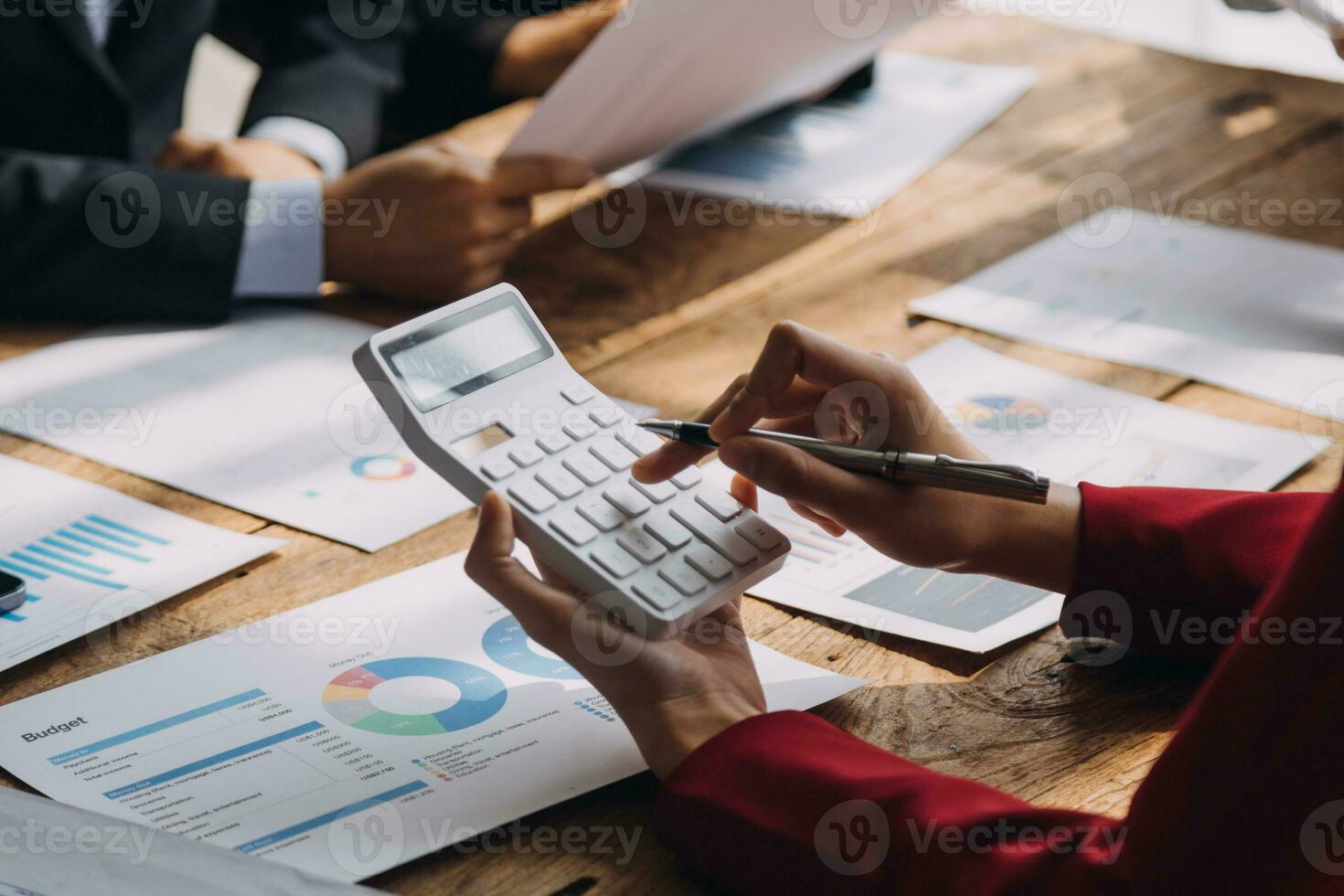 Financial analysts analyze business financial reports on a digital tablet planning investment project during a discussion at a meeting of corporate showing the results of their successful teamwork. photo