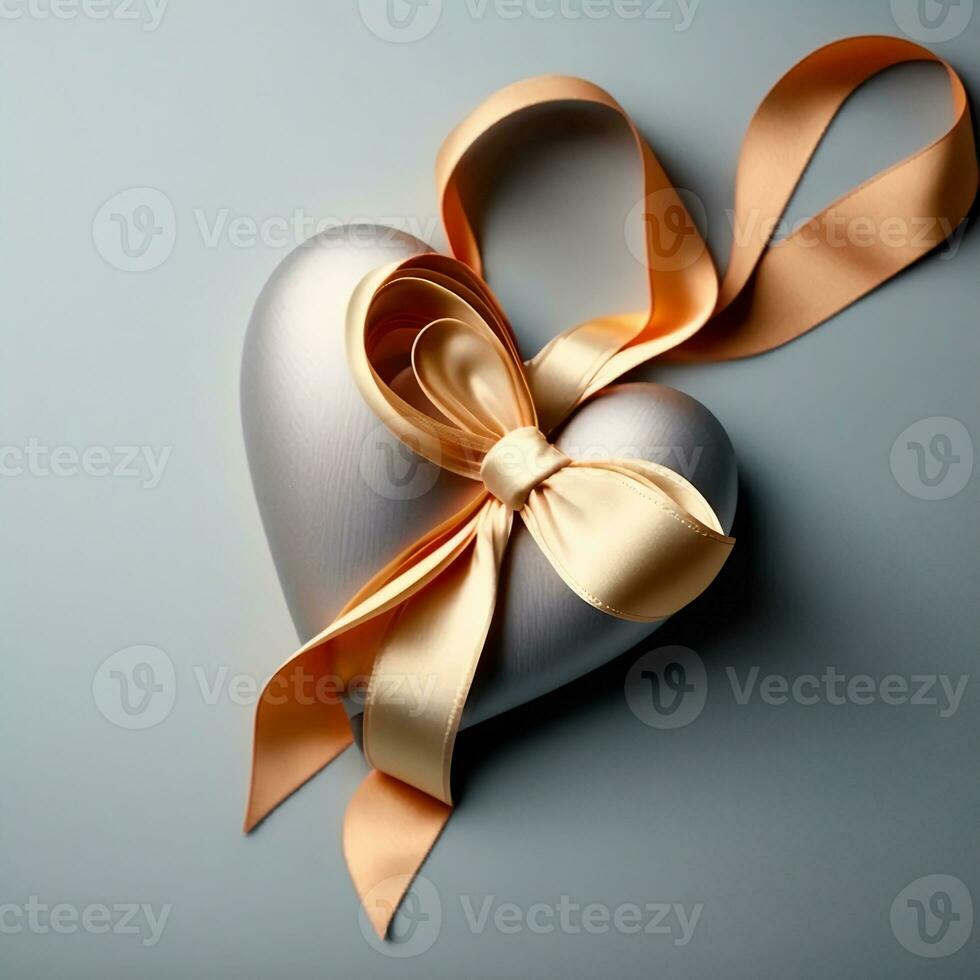 3D Render of Glossy Silver Heart Shape Wrapped With Golden Silk Ribbon. photo
