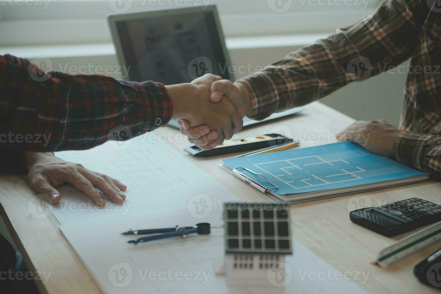 Professional Mechanical Engineer team Working on Personal Computer at Metal lathe industrial manufacturing factory. Engineer Operating lathe Machinery. Product quality Inspection photo
