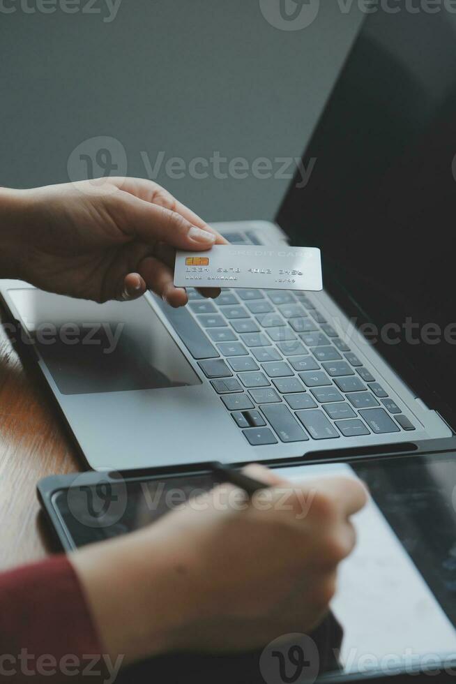Women holding credit card and using smartphones at home.Online shopping, internet banking, store online, payment, spending money, e-commerce payment at the store, credit card, concept photo