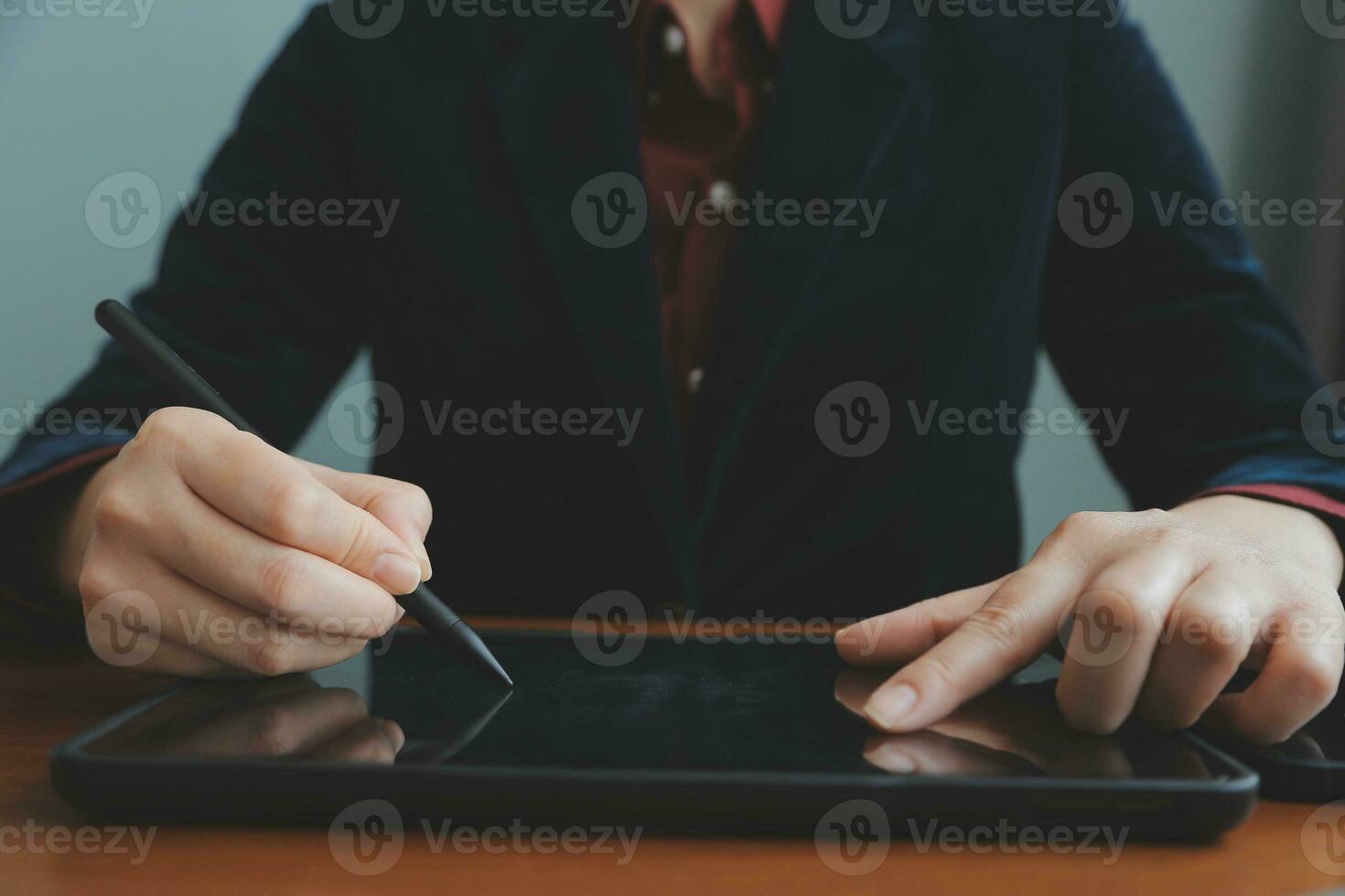 Asian Businesswoman Using laptop computer and working at office with calculator document on desk, doing planning analyzing the financial report, business plan investment, finance analysis concept. photo