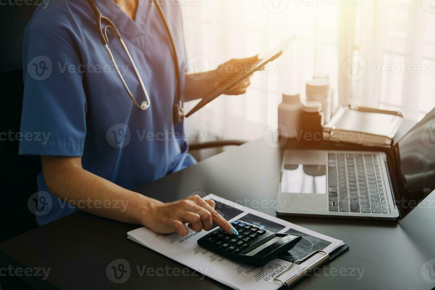 Doctor hand holding pen writing patient history list on clipboard about medication and treatment. photo