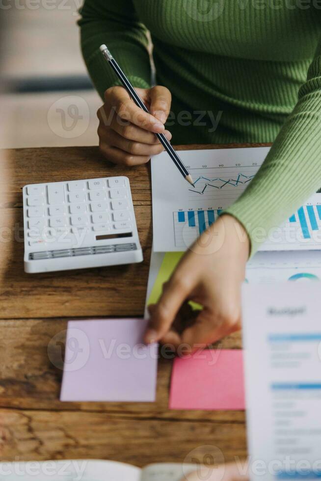 Financial analysts analyze business financial reports on a digital tablet planning investment project during a discussion at a meeting of corporate showing the results of their successful teamwork. photo