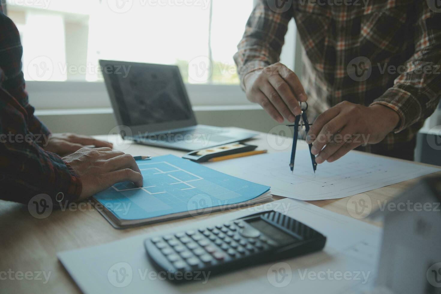 Professional Mechanical Engineer team Working on Personal Computer at Metal lathe industrial manufacturing factory. Engineer Operating lathe Machinery. Product quality Inspection photo
