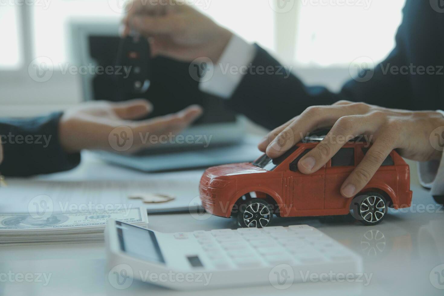 Closeup asian male people car salesman or sales manager offers to sell a car and explains and reads the terms of signing a car contract and insurance. photo