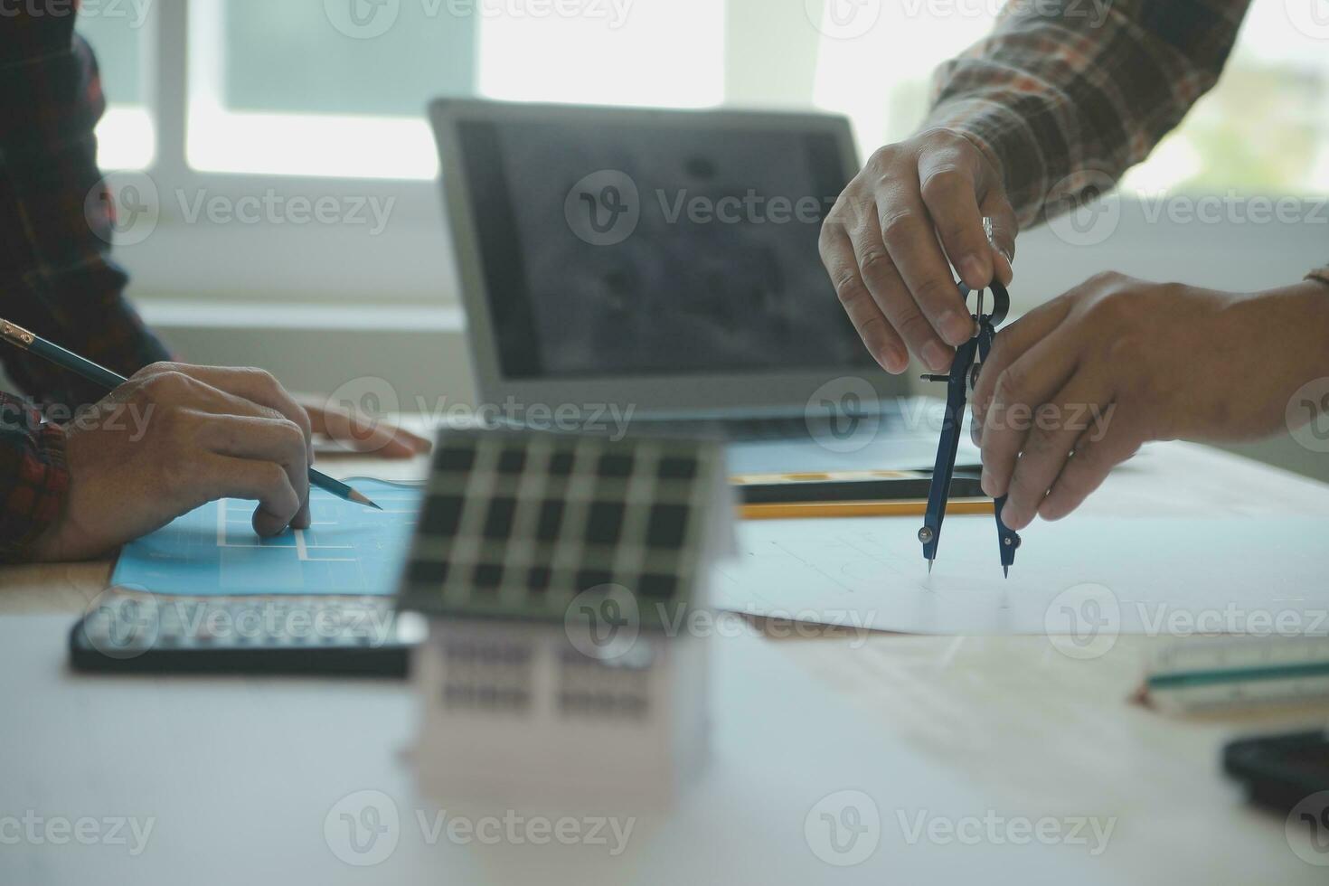 Professional Mechanical Engineer team Working on Personal Computer at Metal lathe industrial manufacturing factory. Engineer Operating lathe Machinery. Product quality Inspection photo