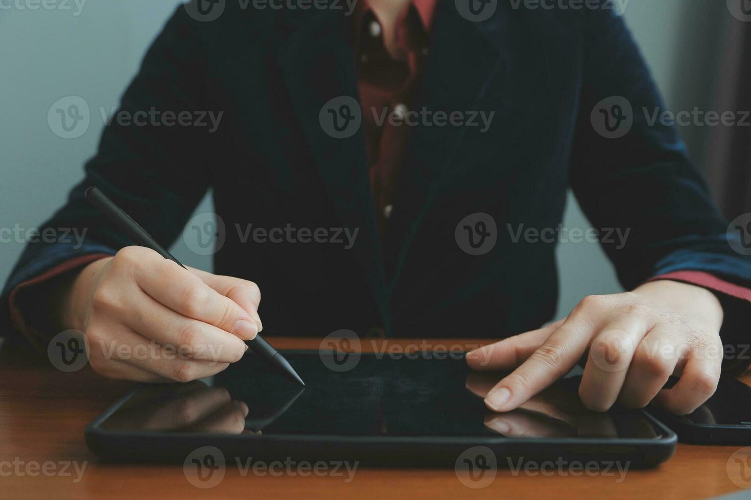 Asian Businesswoman Using laptop computer and working at office with calculator document on desk, doing planning analyzing the financial report, business plan investment, finance analysis concept. photo
