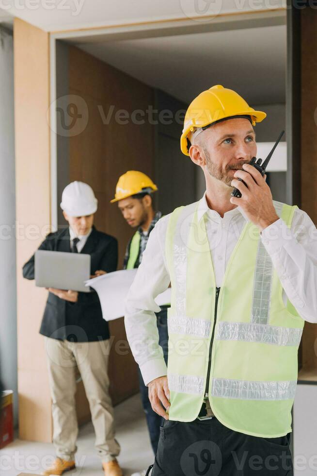 Professional Mechanical Engineer team Working on Personal Computer at Metal lathe industrial manufacturing factory. Engineer Operating lathe Machinery. Product quality Inspection photo