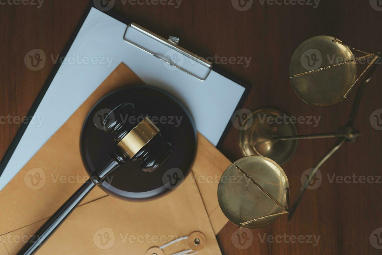 Business and lawyers discussing contract papers with brass scale on desk in office. Law, legal services, advice, justice and law concept picture with film grain effect photo