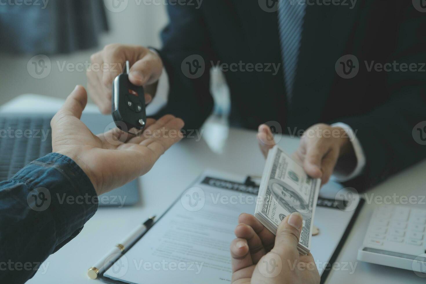 Closeup asian male people car salesman or sales manager offers to sell a car and explains and reads the terms of signing a car contract and insurance. photo