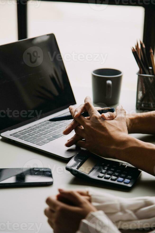 Financial Business team present. Business man hands hold documents with financial statistic stock photo, discussion, and analysis report data the charts and graphs. Finance Financial concept photo