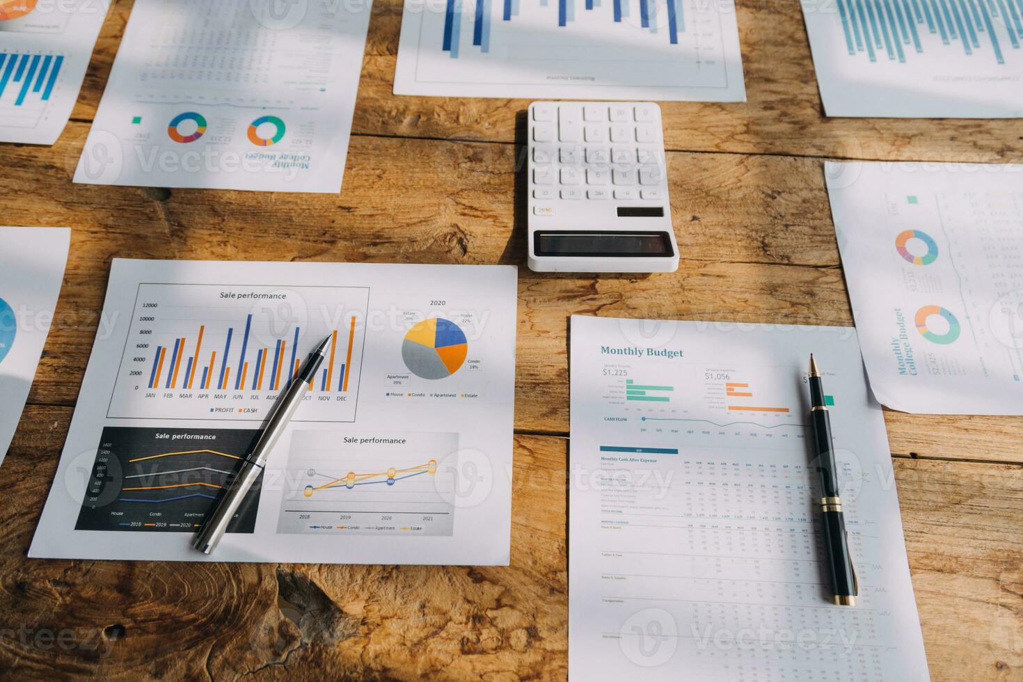 Financial analysts analyze business financial reports on a digital tablet planning investment project during a discussion at a meeting of corporate showing the results of their successful teamwork. photo