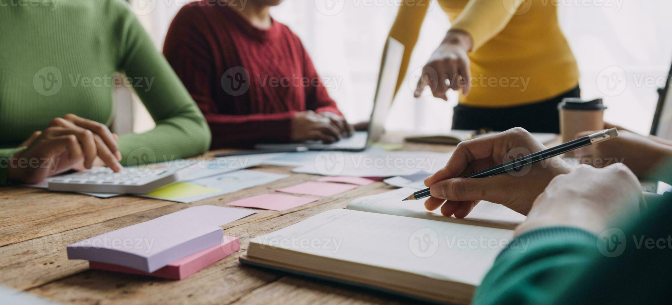Financial analysts analyze business financial reports on a digital tablet planning investment project during a discussion at a meeting of corporate showing the results of their successful teamwork. photo