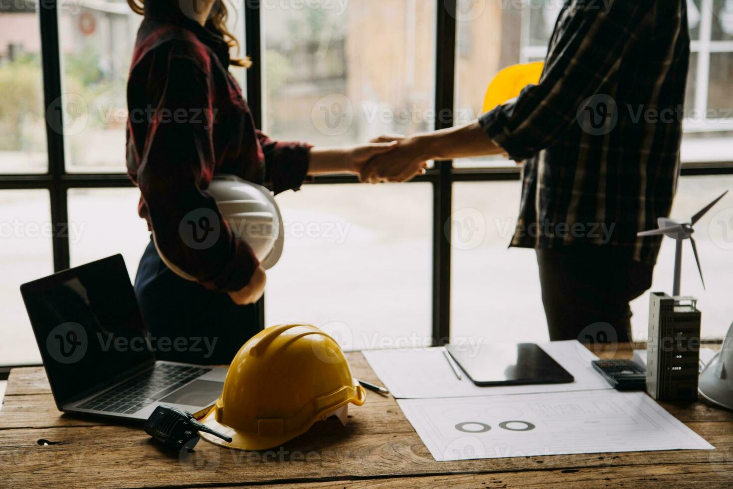 Professional Mechanical Engineer team Working on Personal Computer at Metal lathe industrial manufacturing factory. Engineer Operating lathe Machinery. Product quality Inspection photo