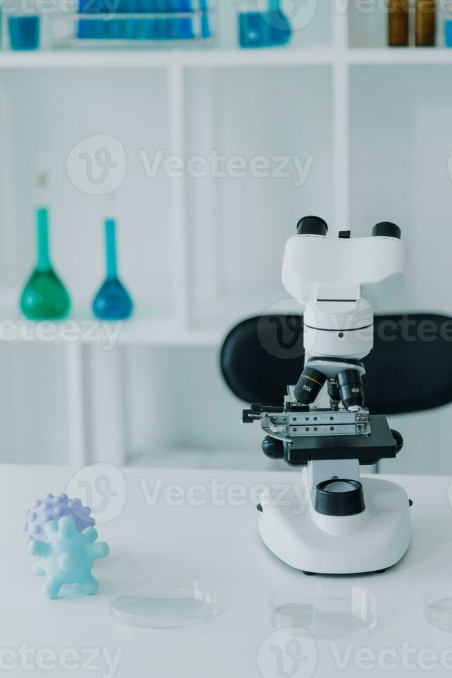 Medical Development Laboratory Caucasian Female Scientist Looking Under Microscope, Analyzes Petri Dish Sample. Specialists Working on Medicine, Biotechnology Research in Advanced Pharma Lab photo