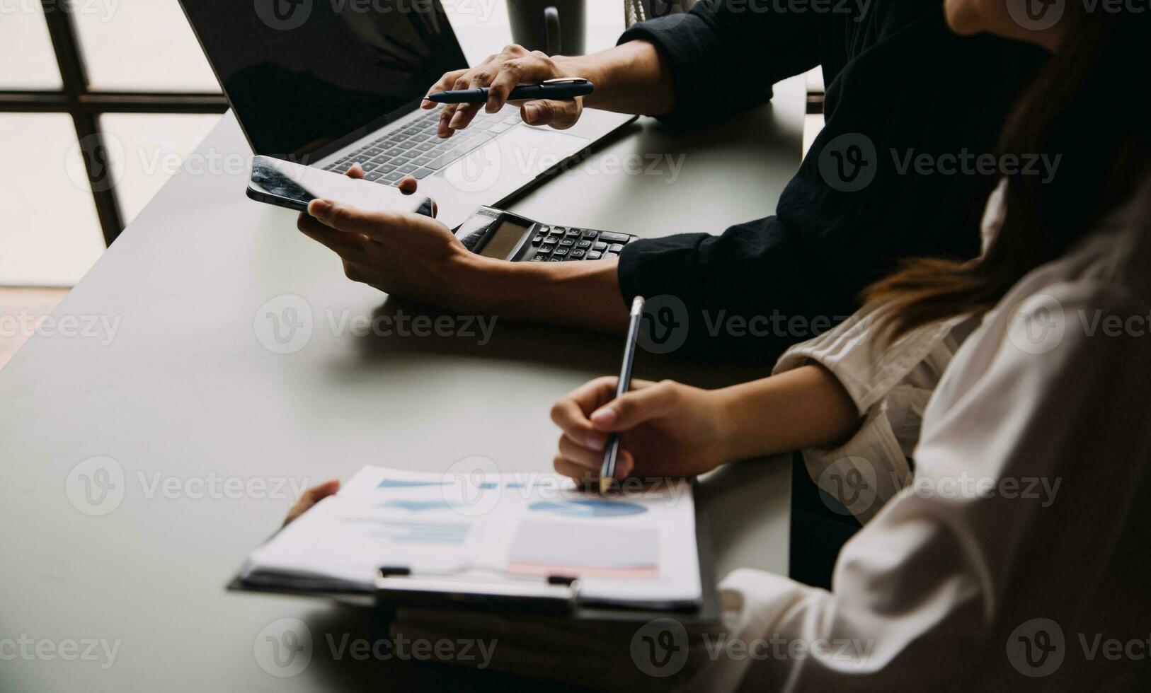 Financial Business team present. Business man hands hold documents with financial statistic stock photo, discussion, and analysis report data the charts and graphs. Finance Financial concept photo