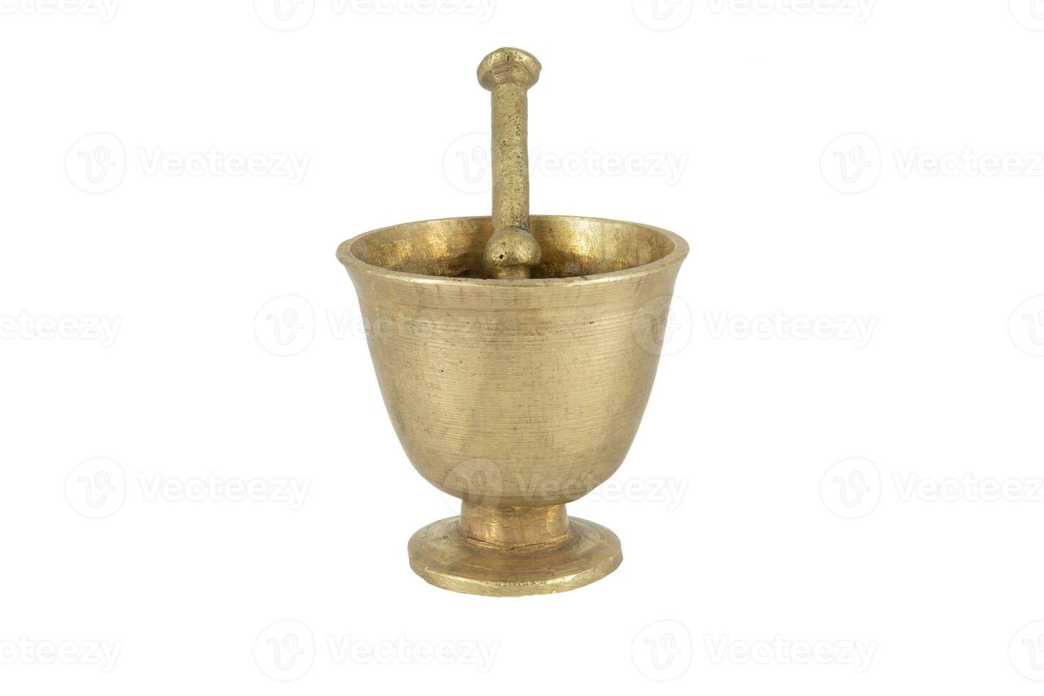 Antique brass mortar with pestle isolated on white background photo