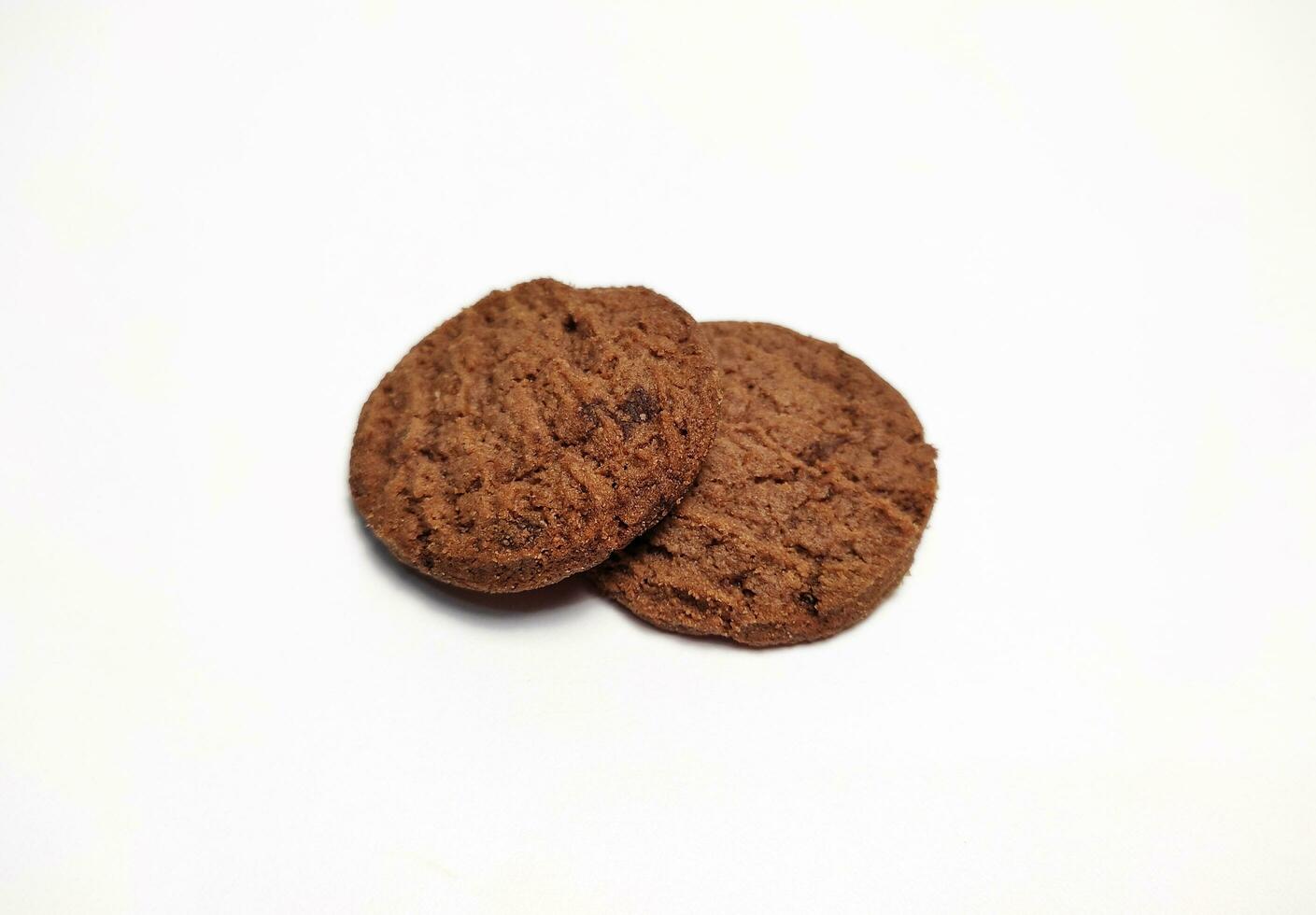 Several round shaped chocolate biscuits isolated on a white background. photo