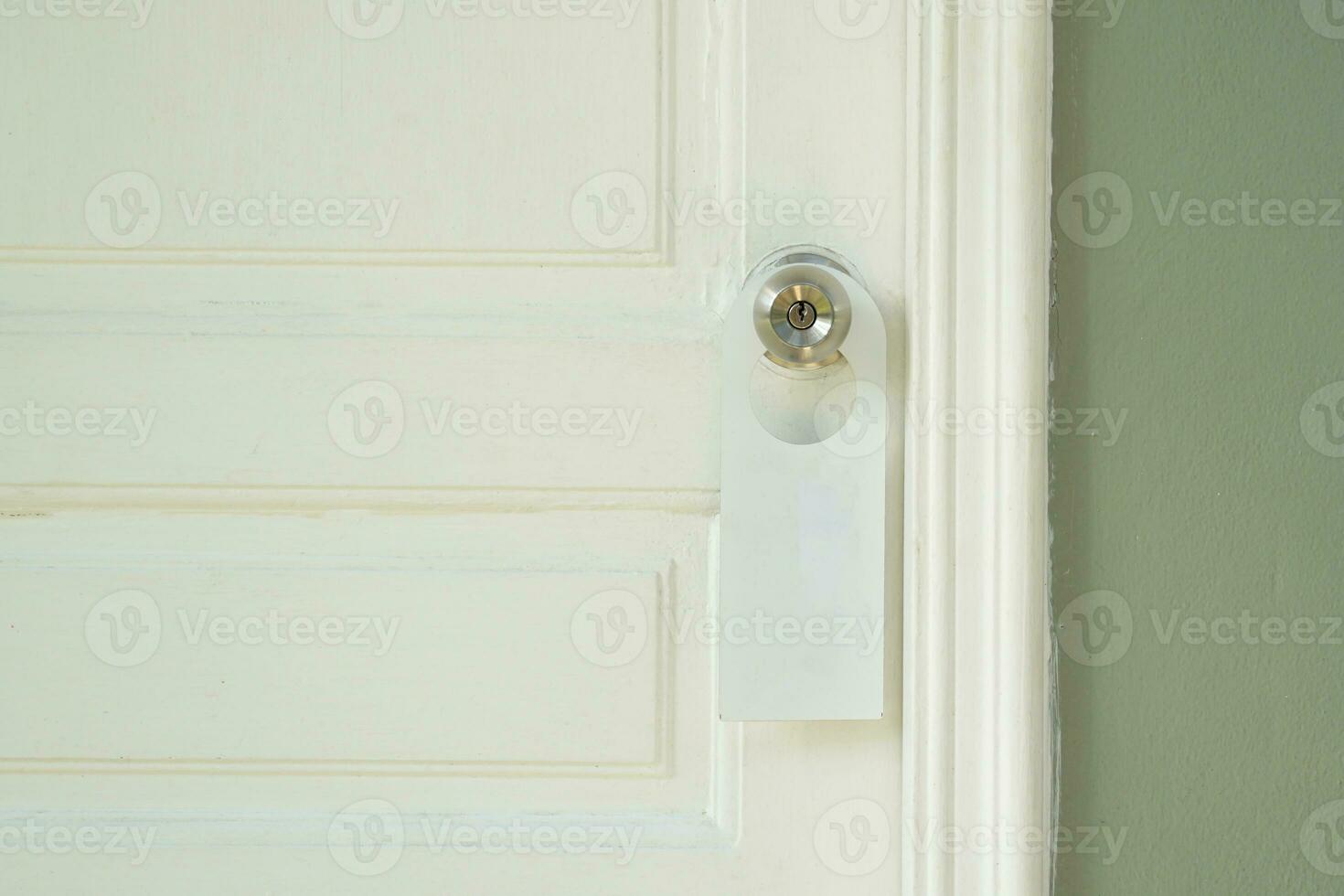 white door hanger for hotels, hang it on the doorknob in front of the room. In order for guests to notify the need for service There is a message in the sign, such as Make Up Room, Do Not Disturb. photo