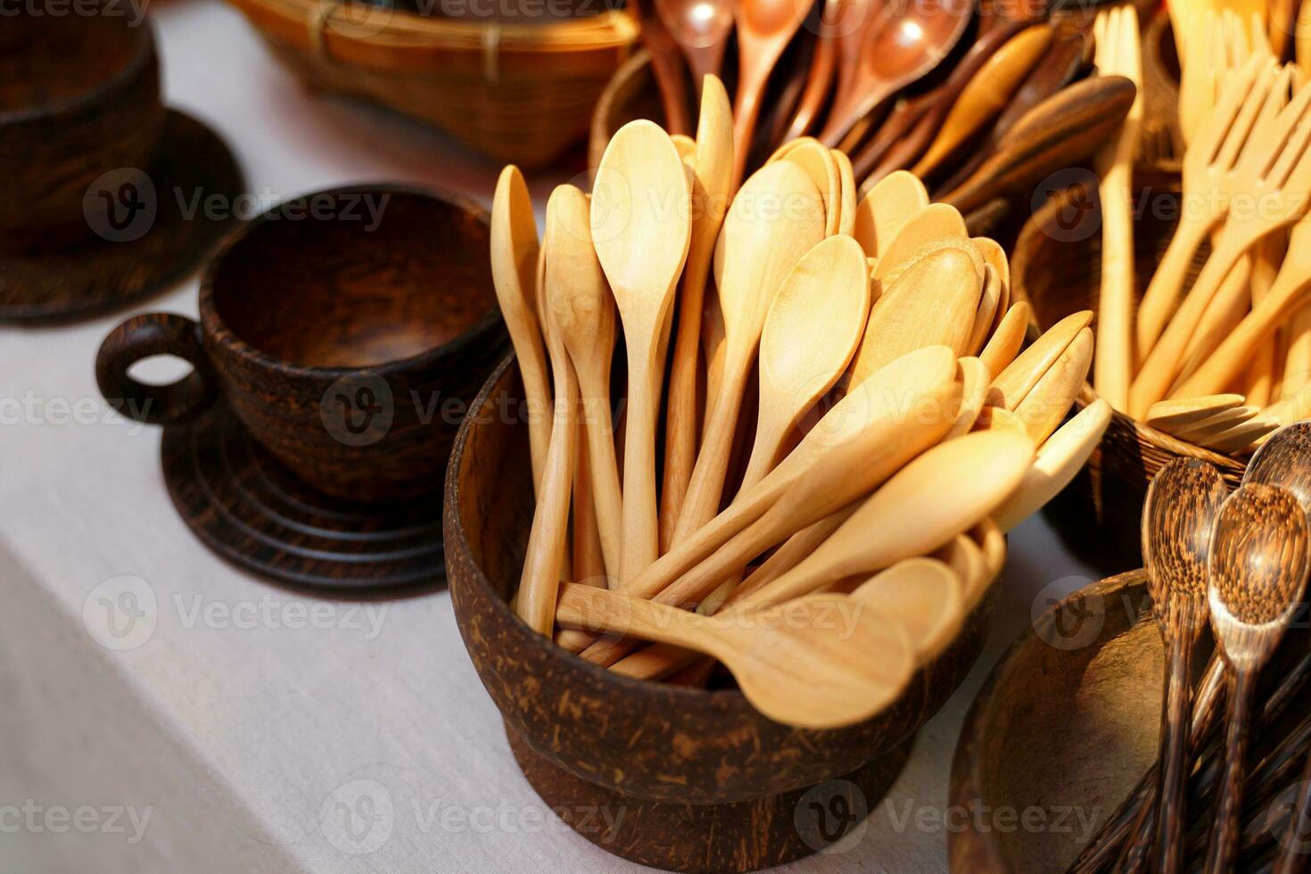 products from coconut shells A variety of designs, including teaspoons, glasses, cups, ladles, which are community products. Soft and selective focus. photo