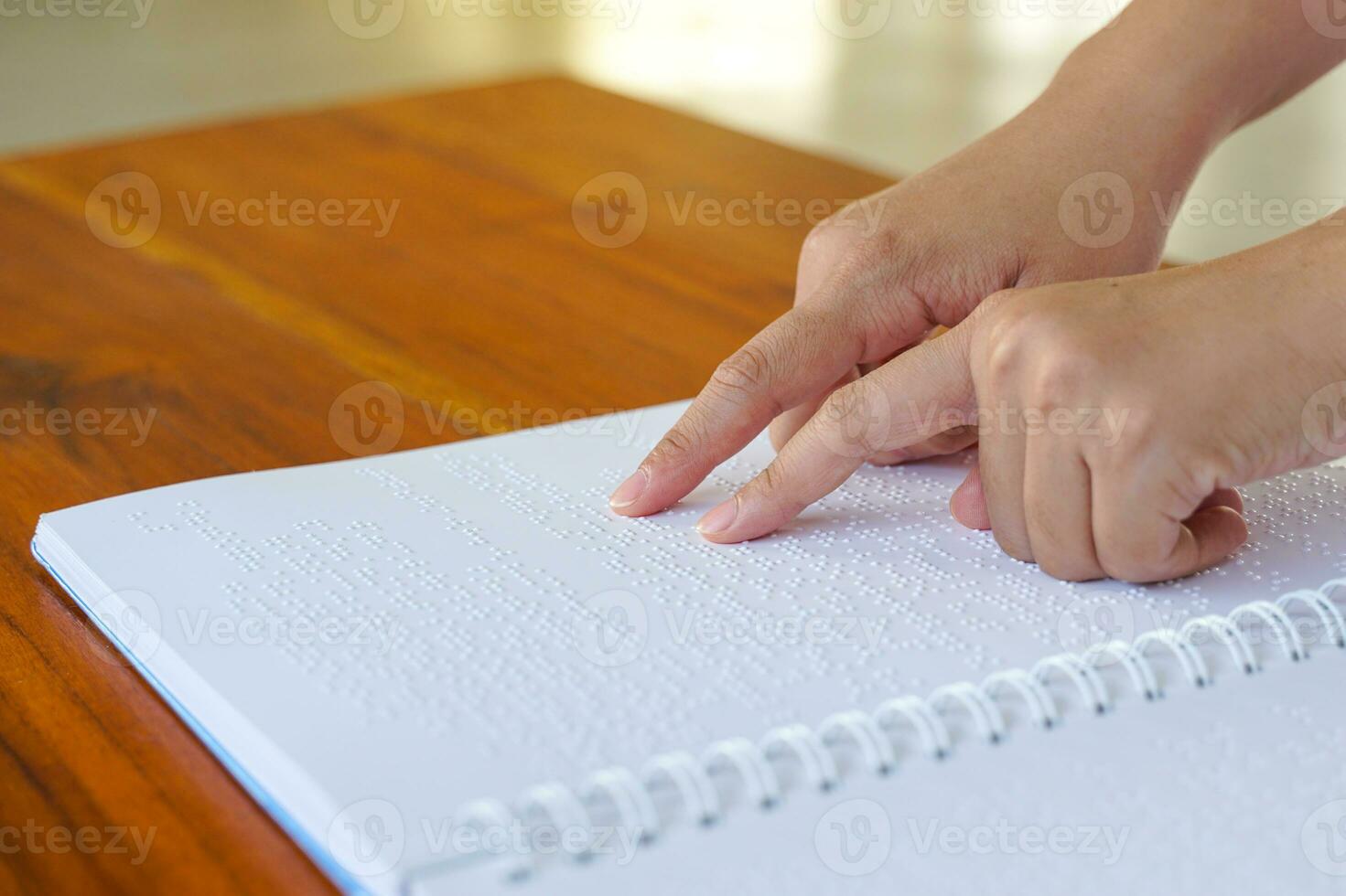 Hand palpation of the letter Bail, which is a letter for the blind, looks like a small convex point in one box, consisting of 6 points, which are arranged in alternating groups to form a code. photo