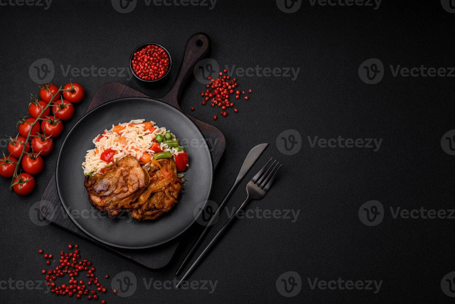 Delicious boiled rice with peppers, peas, asparagus beans and carrots and fried chicken photo