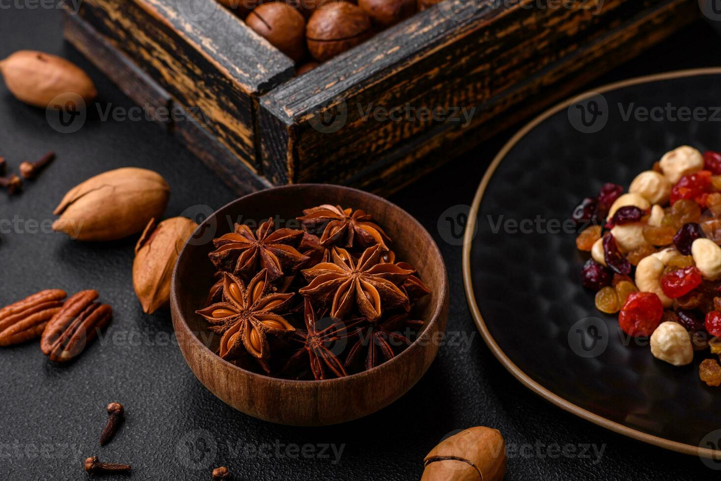 Roasted pecans and macadamia nuts, dried tangerine, dried berries photo